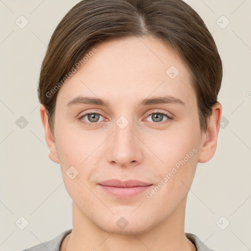 Joyful white young-adult female with short  brown hair and grey eyes