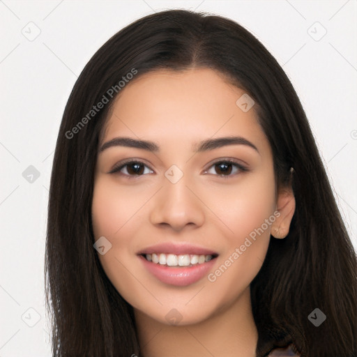 Joyful latino young-adult female with long  black hair and brown eyes