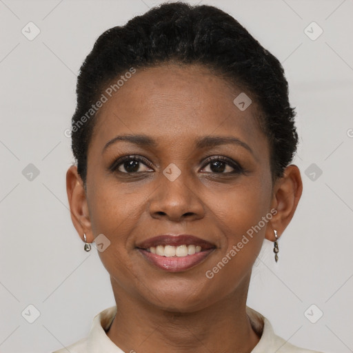 Joyful black young-adult female with short  brown hair and brown eyes