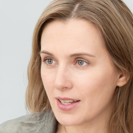 Neutral white young-adult female with long  brown hair and blue eyes