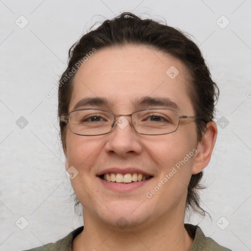 Joyful white adult female with medium  brown hair and brown eyes