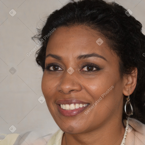 Joyful black young-adult female with medium  brown hair and brown eyes