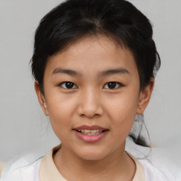 Joyful asian child female with short  brown hair and brown eyes