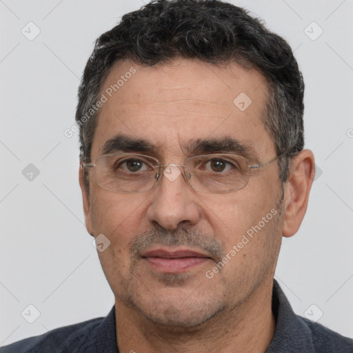 Joyful white adult male with short  black hair and brown eyes
