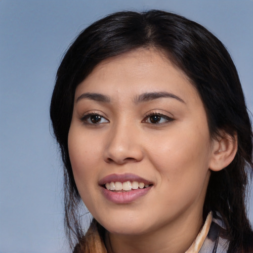 Joyful white young-adult female with long  black hair and brown eyes