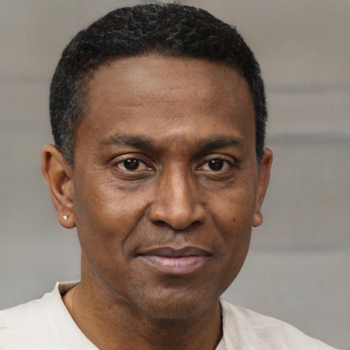 Neutral black adult male with short  brown hair and brown eyes