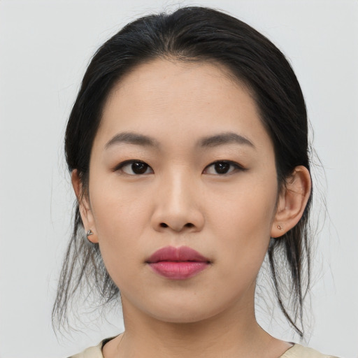 Joyful asian young-adult female with medium  black hair and brown eyes