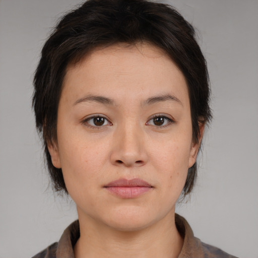 Neutral asian young-adult female with medium  brown hair and brown eyes