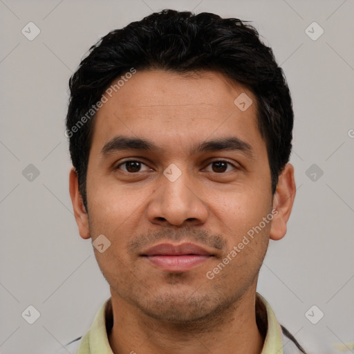 Joyful white young-adult male with short  black hair and brown eyes