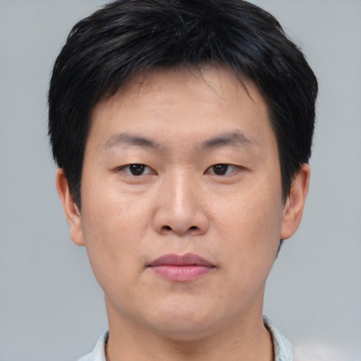 Neutral asian young-adult male with short  brown hair and brown eyes