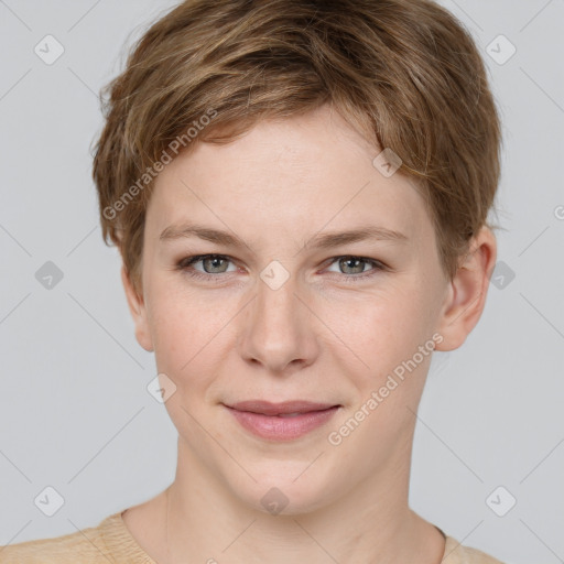 Joyful white young-adult female with short  brown hair and grey eyes