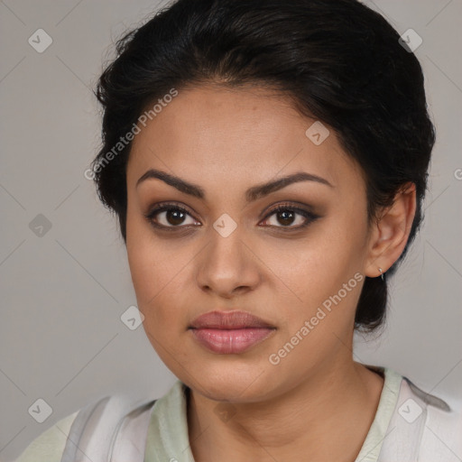 Joyful latino young-adult female with medium  brown hair and brown eyes