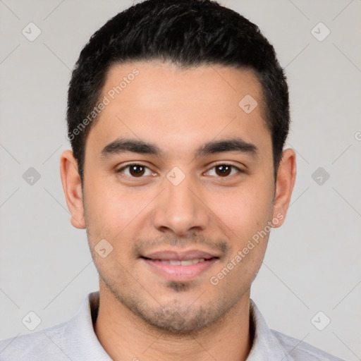 Joyful white young-adult male with short  black hair and brown eyes