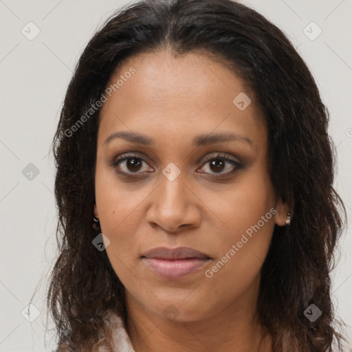 Joyful black young-adult female with long  brown hair and brown eyes