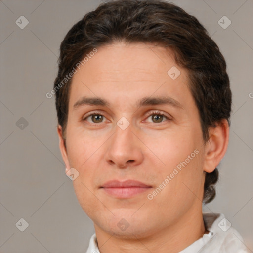 Joyful white adult male with short  brown hair and brown eyes