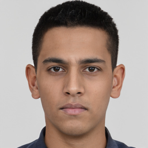 Neutral latino young-adult male with short  brown hair and brown eyes