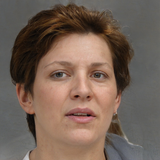 Joyful white adult female with medium  brown hair and grey eyes