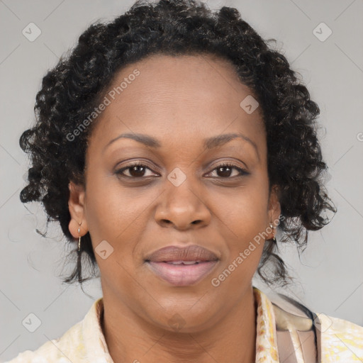 Joyful black adult female with medium  brown hair and brown eyes