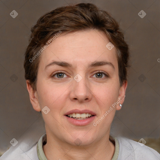 Joyful white young-adult female with short  brown hair and grey eyes