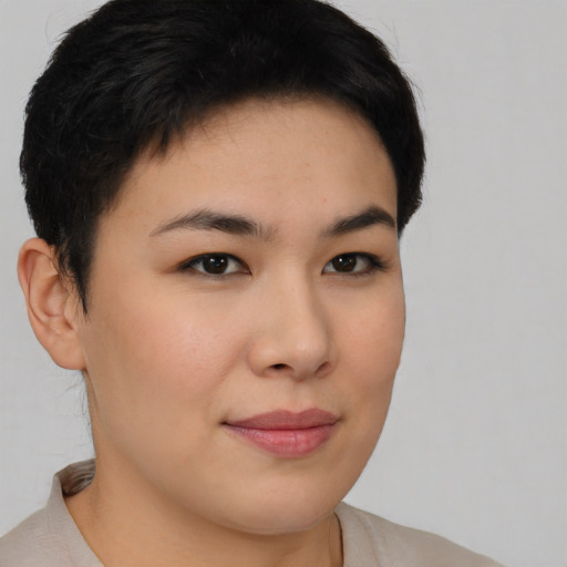 Joyful asian young-adult female with short  brown hair and brown eyes