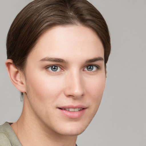 Joyful white young-adult female with short  brown hair and grey eyes