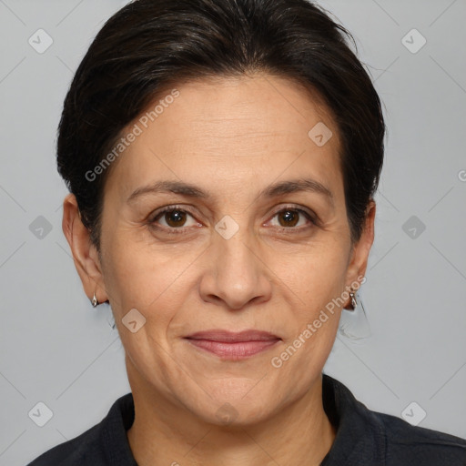 Joyful white adult female with medium  brown hair and brown eyes