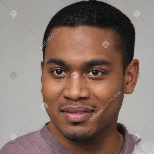 Joyful black young-adult male with short  black hair and brown eyes