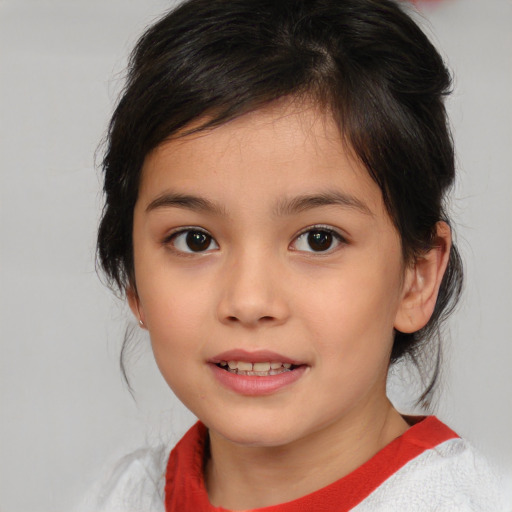 Joyful asian child female with medium  brown hair and brown eyes