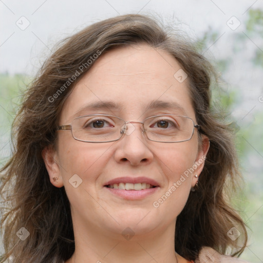 Joyful white adult female with medium  brown hair and blue eyes