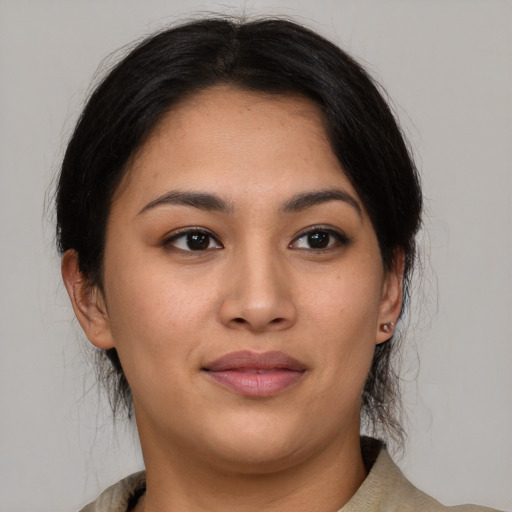 Joyful asian young-adult female with medium  brown hair and brown eyes