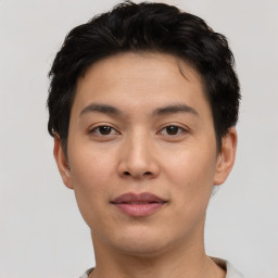 Joyful asian young-adult male with short  black hair and brown eyes