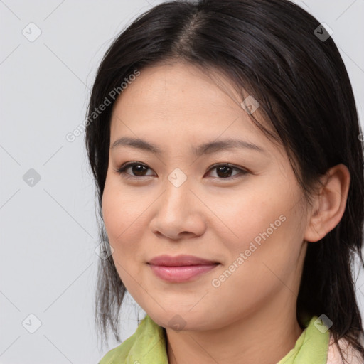 Joyful asian young-adult female with medium  brown hair and brown eyes