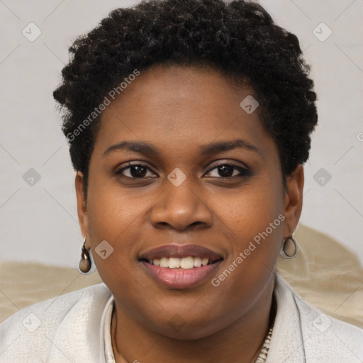 Joyful black young-adult female with short  brown hair and brown eyes