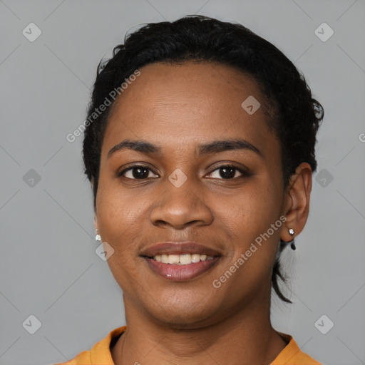 Joyful black young-adult female with short  black hair and brown eyes