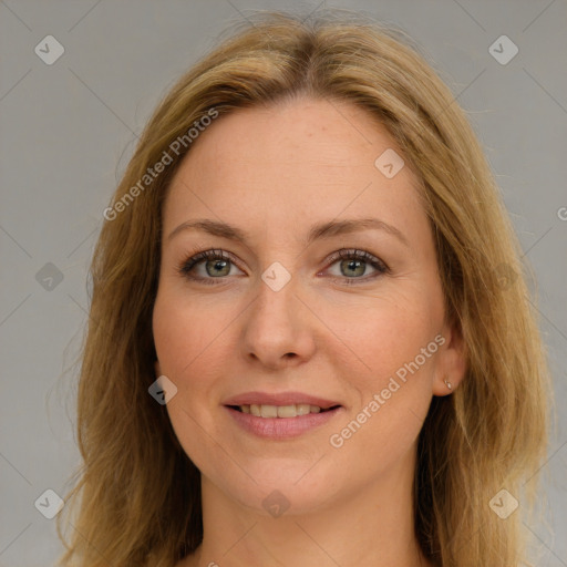 Joyful white young-adult female with long  brown hair and green eyes