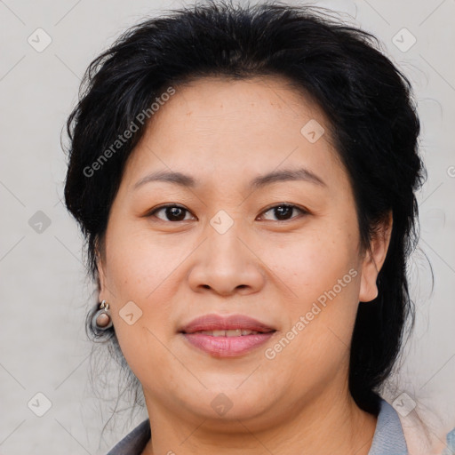 Joyful asian adult female with medium  brown hair and brown eyes