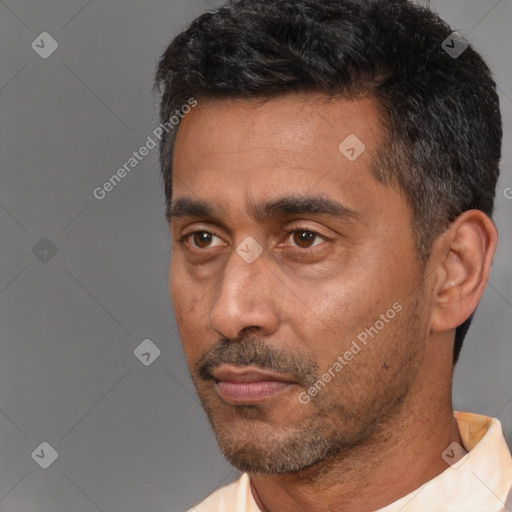 Neutral white adult male with short  black hair and brown eyes
