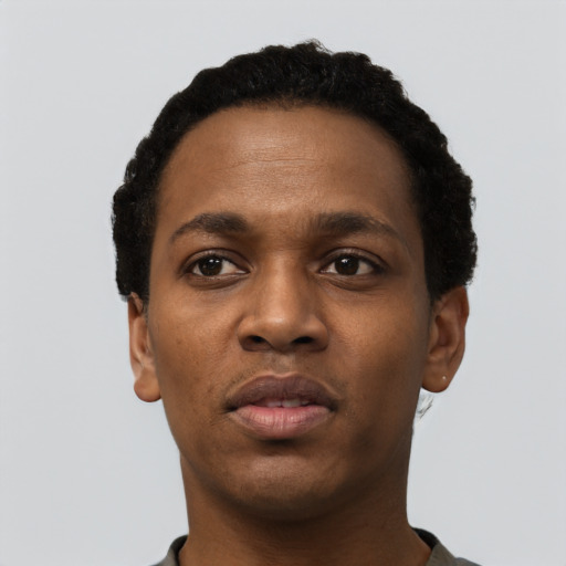 Neutral black young-adult female with short  black hair and brown eyes