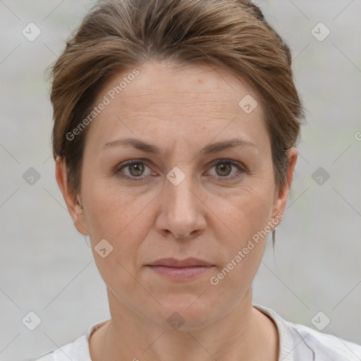 Joyful white adult female with short  brown hair and brown eyes