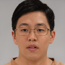 Neutral asian young-adult male with short  brown hair and brown eyes