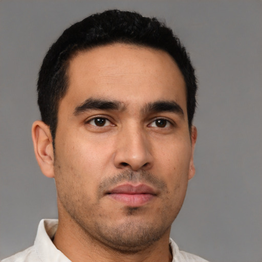 Neutral latino young-adult male with short  brown hair and brown eyes