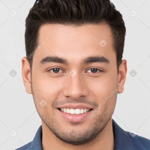 Joyful white young-adult male with short  brown hair and brown eyes