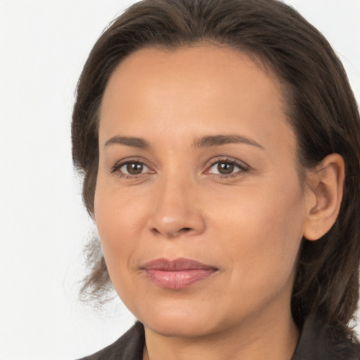 Joyful white adult female with medium  brown hair and brown eyes