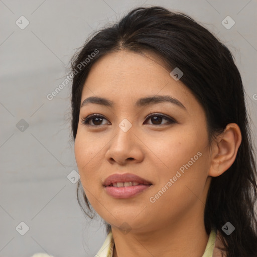 Joyful asian young-adult female with long  brown hair and brown eyes