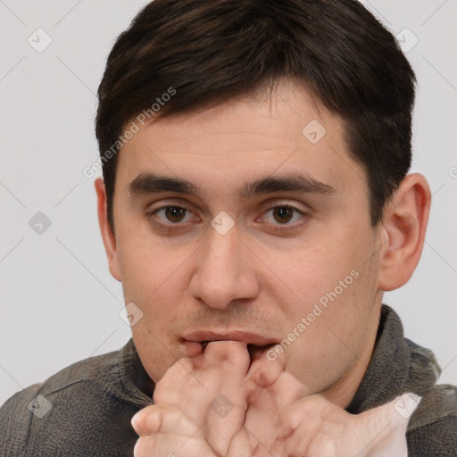 Neutral white young-adult male with short  brown hair and brown eyes