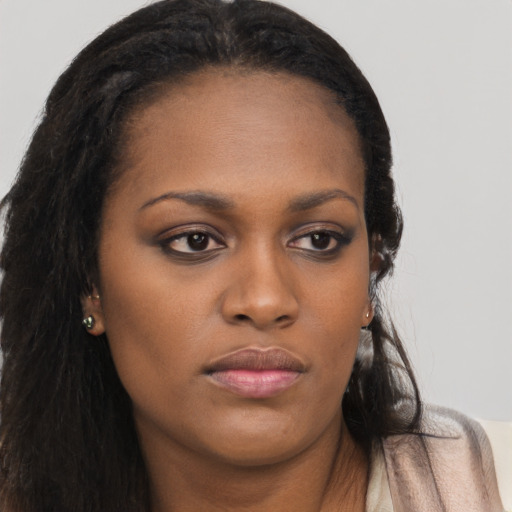 Neutral black young-adult female with long  brown hair and brown eyes