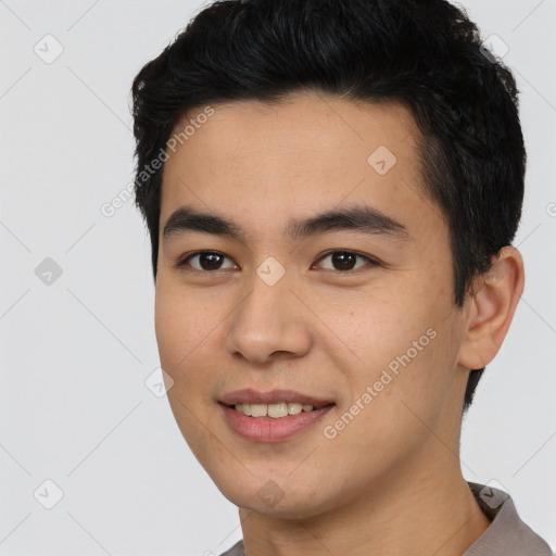 Joyful asian young-adult male with short  black hair and brown eyes