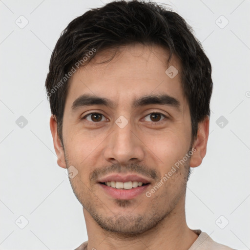 Joyful white young-adult male with short  black hair and brown eyes