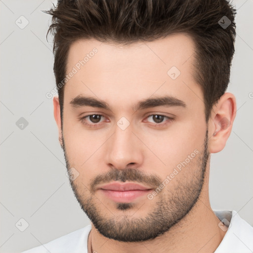 Neutral white young-adult male with short  brown hair and brown eyes