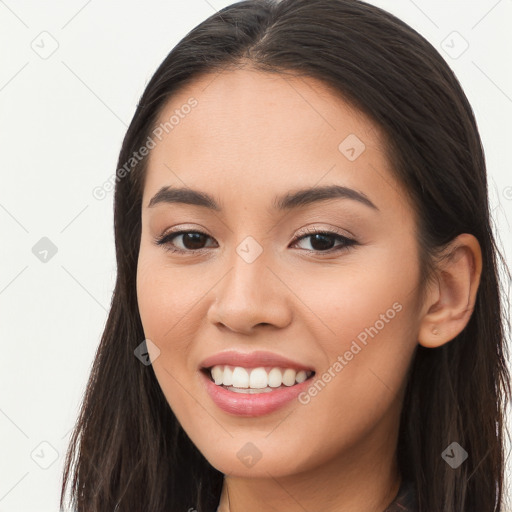 Joyful white young-adult female with long  brown hair and brown eyes